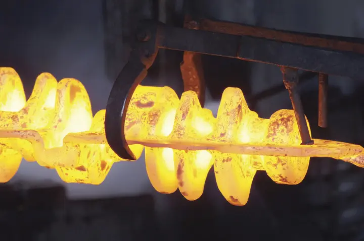 hot crankshaft being forged